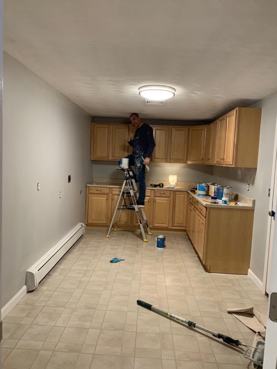 Painter cutting in a ceiling