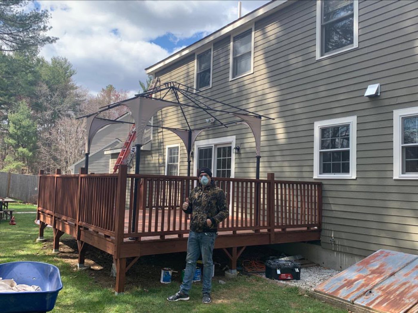 Gabo Painting crew member in front of a finished deck